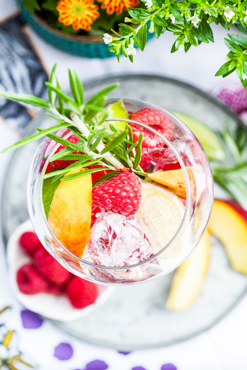 Hibiscus infused Raspberry Secco Punch with Peach and Rosemary | GourmetGuerilla.com