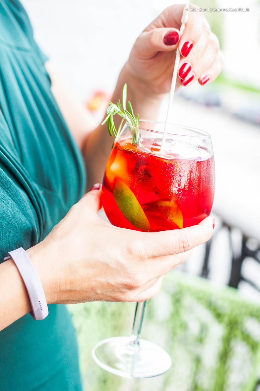 Hibiscus infused raspberry secco punch with peaches and rosemary. A summer punch in a glass.